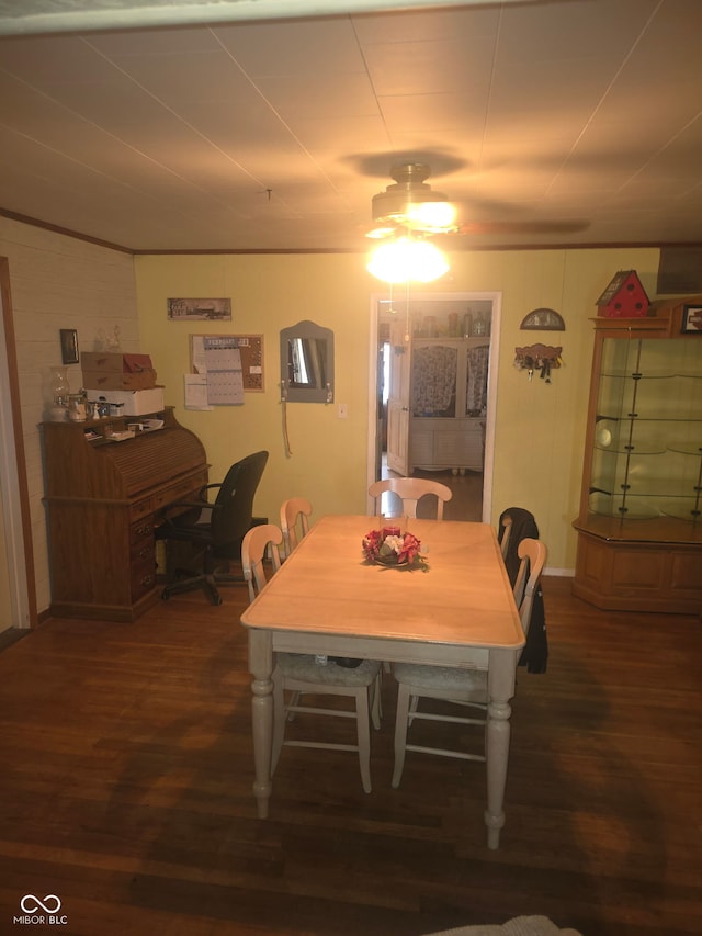 dining room featuring dark wood finished floors and a ceiling fan