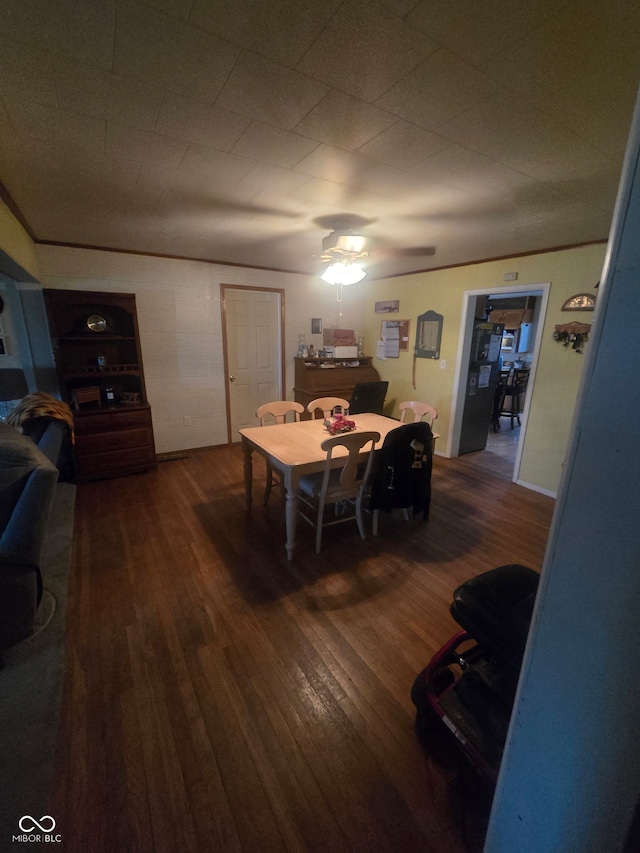 dining area featuring hardwood / wood-style floors and a ceiling fan