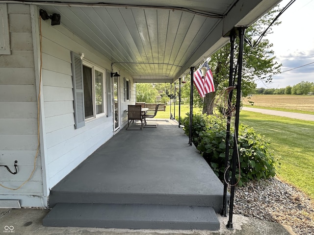 245 W Dixie Bee Rd, Veedersburg, IN 47987 - covered porch with a lawn