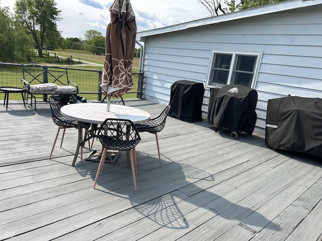 245 W Dixie Bee Rd, Veedersburg, IN 47987 - wooden terrace featuring a grill, outdoor dining area, and a lawn