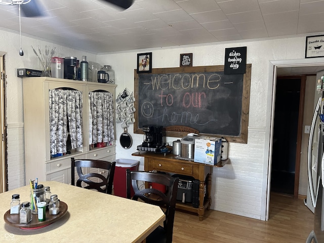 245 W Dixie Bee Rd, Veedersburg, IN 47987 - dining space with wood finished floors and a textured wall