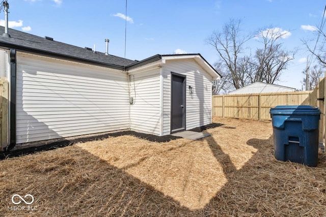 back of property with fence