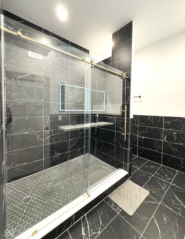 1818 N Cornell Ave, Indianapolis, IN 46202 - bathroom with a stall shower, tile walls, marble finish floors, wainscoting, and recessed lighting