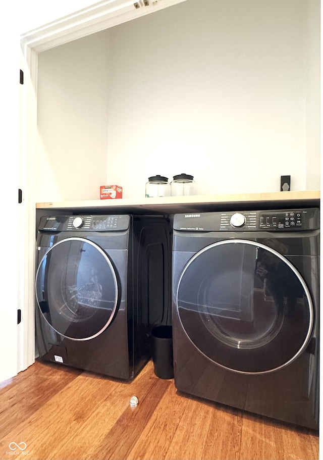 1818 N Cornell Ave, Indianapolis, IN 46202 - laundry area featuring washer and clothes dryer and wood finished floors