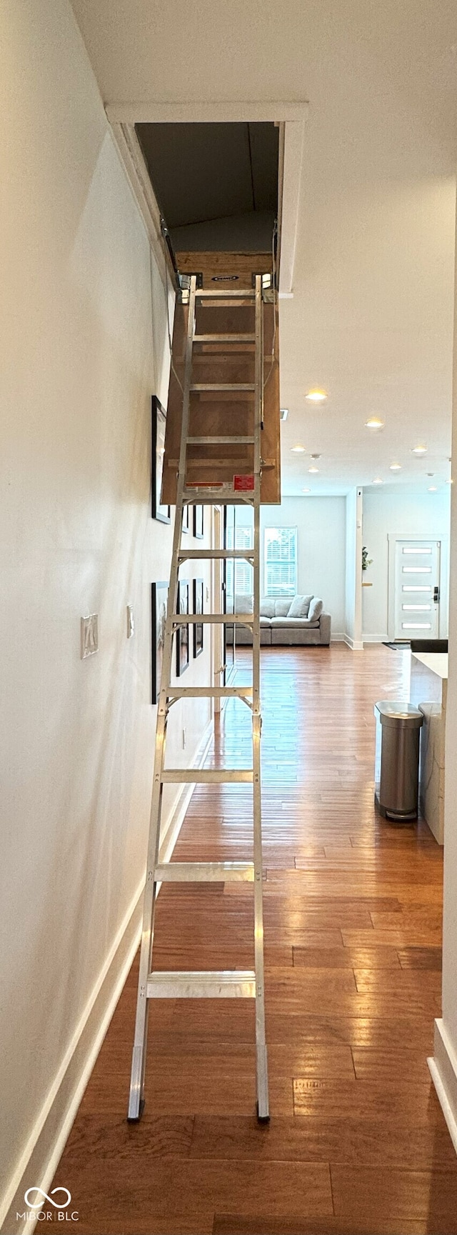 1818 N Cornell Ave, Indianapolis, IN 46202 - stairway with wood-type flooring and baseboards