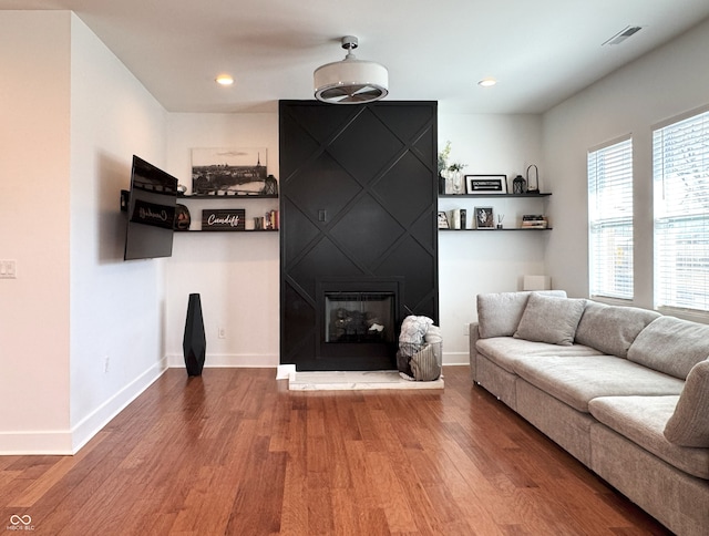 1818 N Cornell Ave, Indianapolis, IN 46202 - living area featuring wood finished floors, a fireplace, baseboards, and recessed lighting