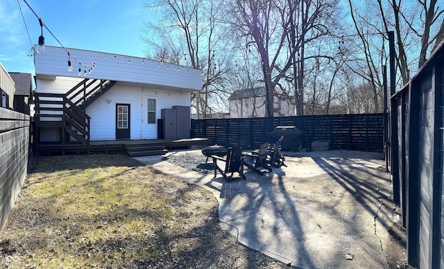 1818 N Cornell Ave, Indianapolis, IN 46202 - fenced backyard with a wooden deck and stairs