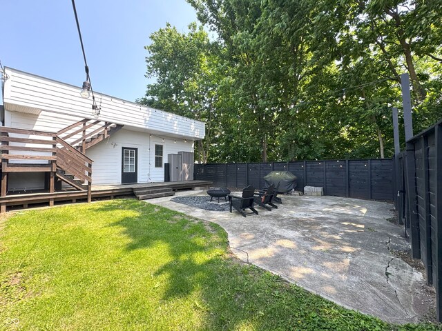 1818 N Cornell Ave, Indianapolis, IN 46202 - view of yard featuring a fire pit, a deck, stairs, and a patio