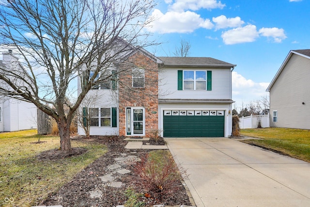 traditional-style house featuring brick siding, a front yard, fence, a garage, and driveway