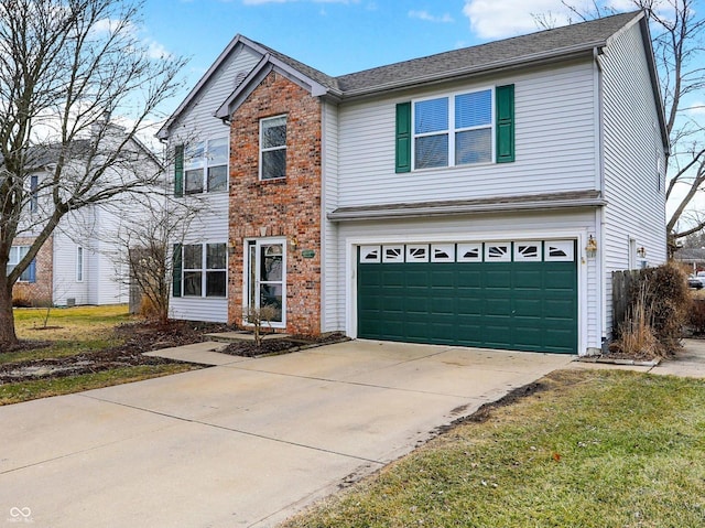 traditional home with concrete driveway, brick siding, and an attached garage