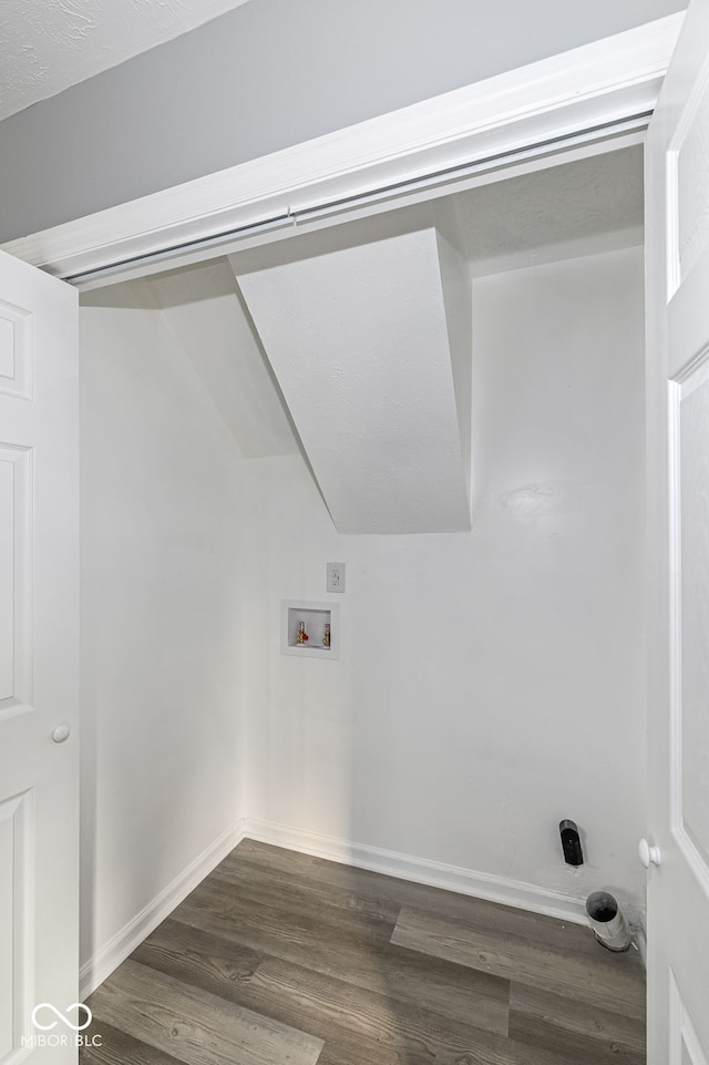 clothes washing area featuring laundry area, dark wood-type flooring, hookup for a washing machine, and baseboards