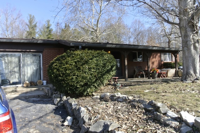 view of front of home featuring brick siding