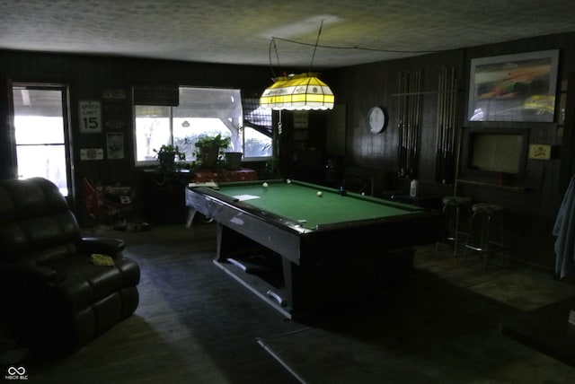 recreation room with a textured ceiling and pool table