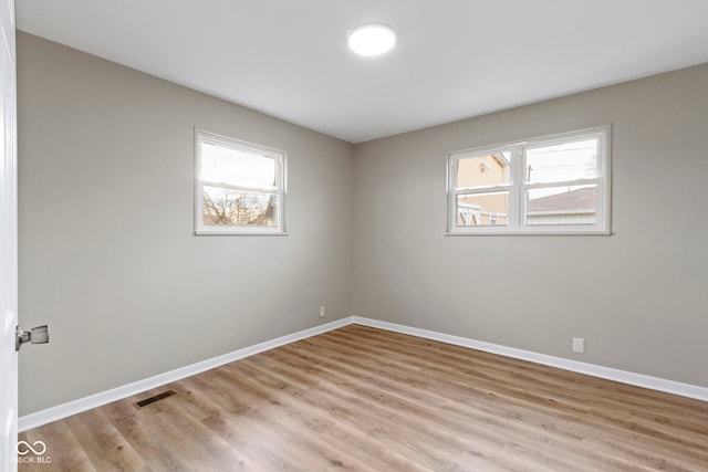 305 Bixler Rd, Indianapolis, IN 46227 - empty room with light wood-style flooring, visible vents, and baseboards