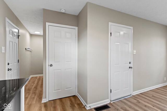 305 Bixler Rd, Indianapolis, IN 46227 - entryway with light wood-type flooring, visible vents, and baseboards