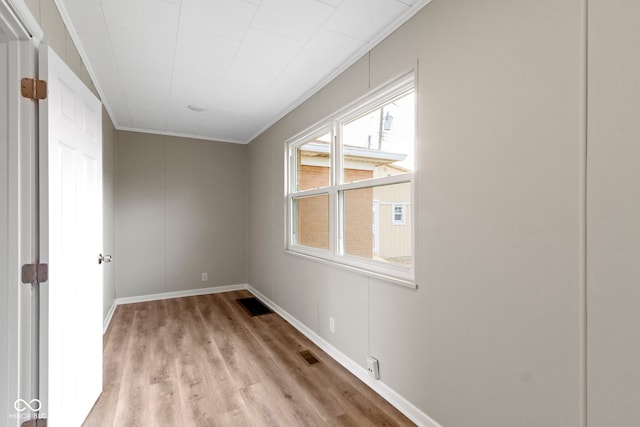 305 Bixler Rd, Indianapolis, IN 46227 - spare room with light wood finished floors, baseboards, visible vents, and ornamental molding