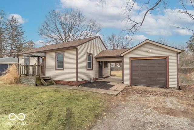 ranch-style house with an attached garage, dirt driveway, and a front lawn