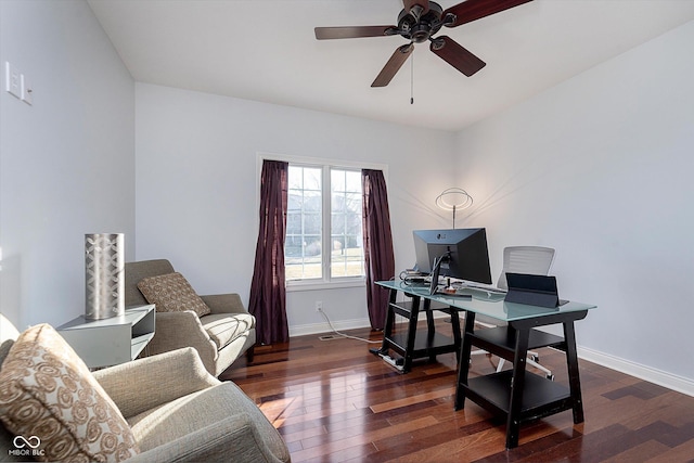 office area featuring a ceiling fan, baseboards, and dark wood-style flooring