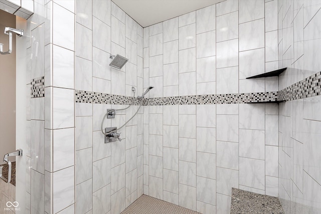 full bath featuring tiled shower