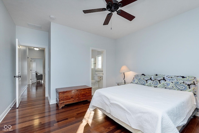 bedroom with wood-type flooring, visible vents, baseboards, and ensuite bathroom