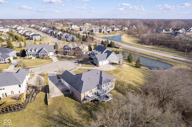 aerial view featuring a residential view and a water view