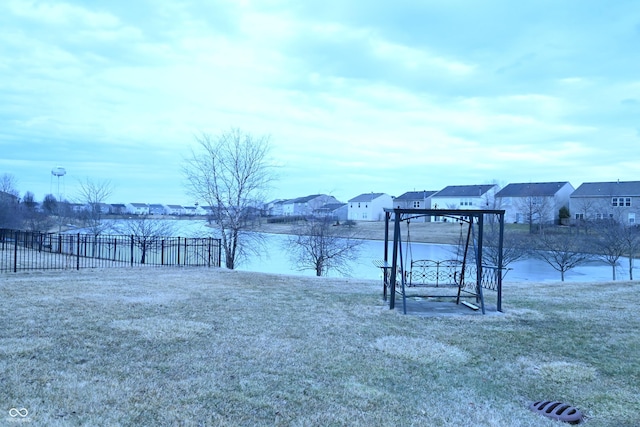 view of yard with a residential view and fence