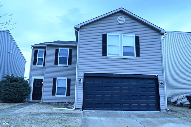 traditional-style house with an attached garage and driveway