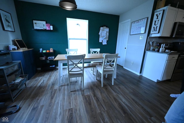 dining room with dark wood-style floors