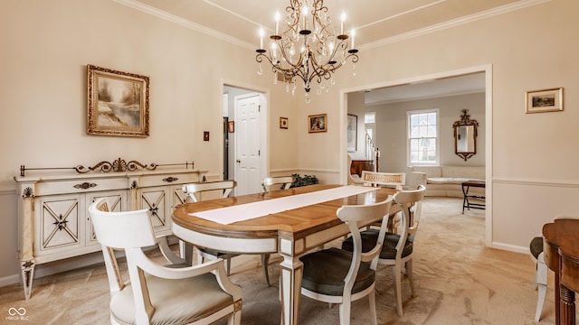 dining room with light carpet, ornamental molding, and baseboards