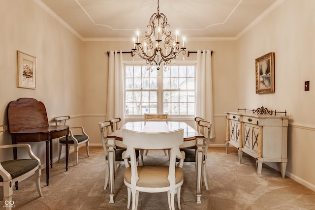 carpeted dining room featuring ornamental molding, baseboards, and an inviting chandelier