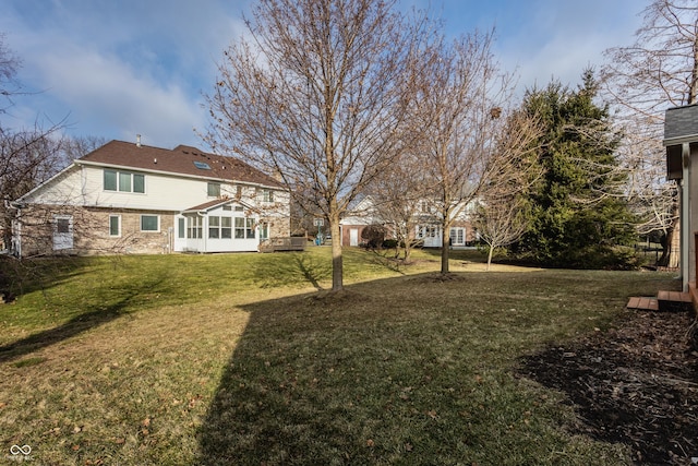 view of yard featuring a sunroom