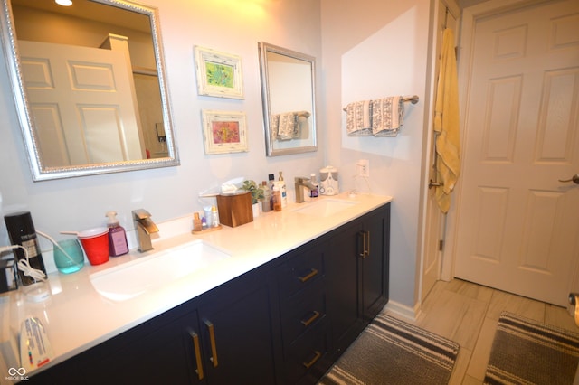 bathroom featuring double vanity and a sink