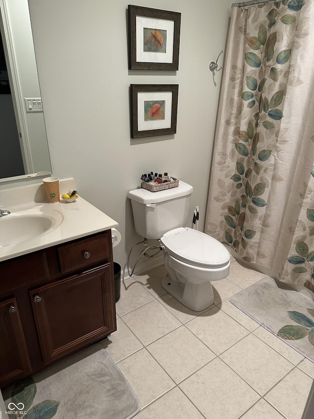 full bath featuring toilet, tile patterned flooring, and vanity