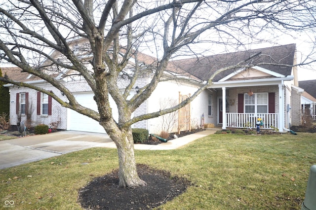 view of front of house featuring driveway, an attached garage, covered porch, a front lawn, and brick siding