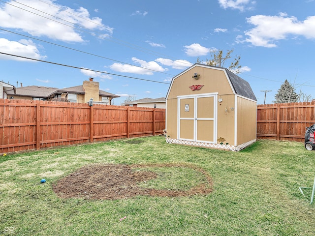 view of shed with a fenced backyard