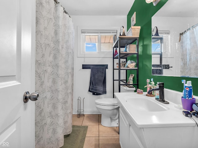 full bathroom with a shower with curtain, vanity, toilet, and tile patterned floors