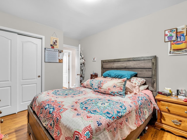 bedroom with a closet and wood finished floors