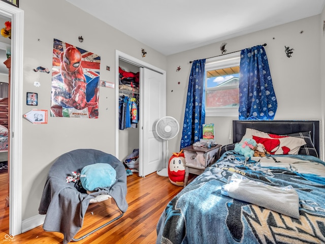 bedroom with a closet and wood finished floors