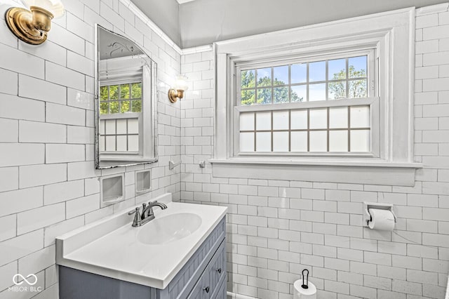 bathroom featuring tile walls and vanity