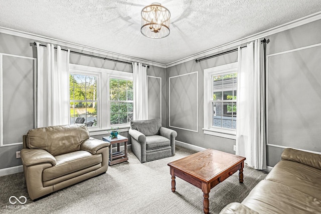 carpeted living area featuring ornamental molding, a notable chandelier, a textured ceiling, and baseboards