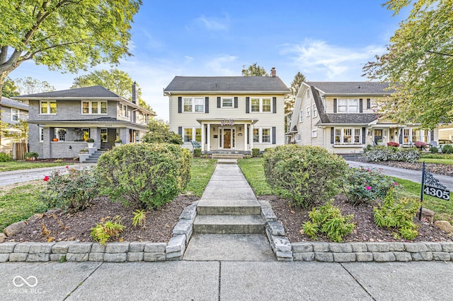 view of front of house featuring a chimney