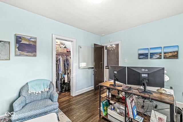 office space featuring baseboards and wood finished floors