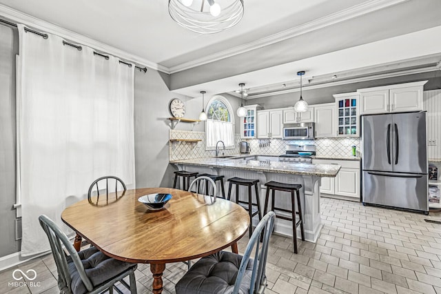 dining room featuring ornamental molding