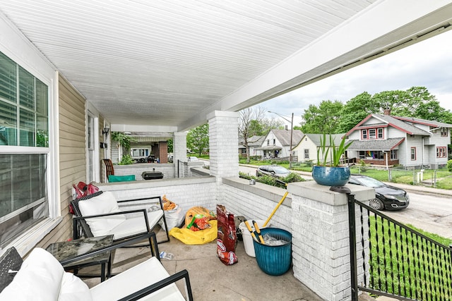 view of patio with a porch and a residential view