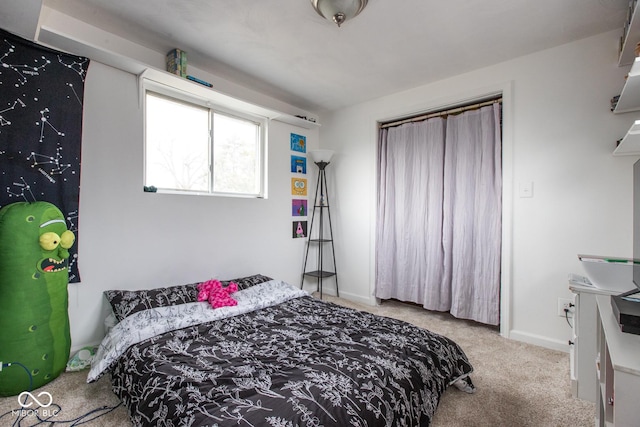 carpeted bedroom with baseboards