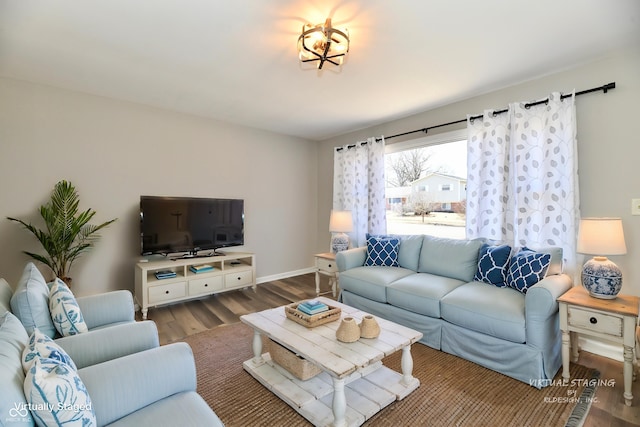 living room with wood finished floors and baseboards