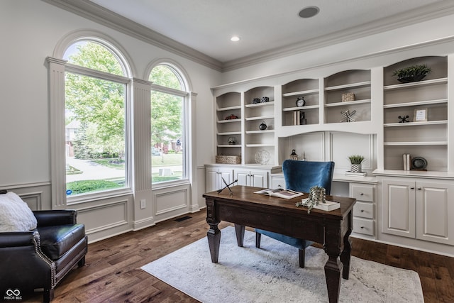 office space featuring dark wood-type flooring, visible vents, crown molding, and a decorative wall