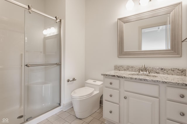 full bathroom with tile patterned floors, a shower stall, toilet, and vanity