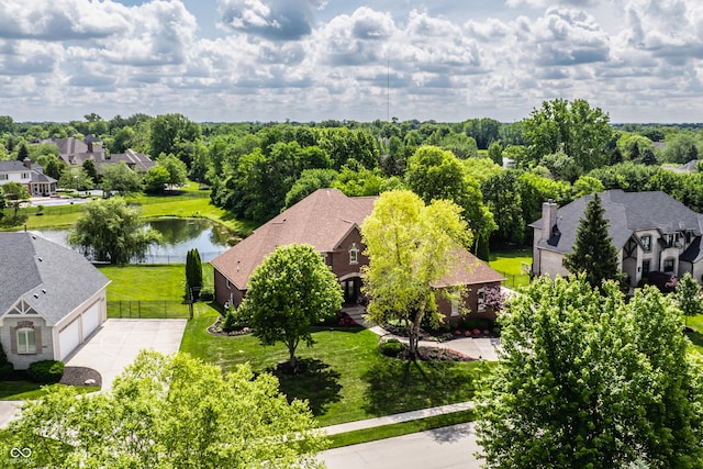 drone / aerial view with a water view and a residential view