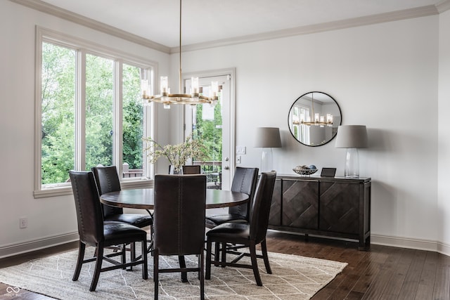 dining area with a chandelier, a healthy amount of sunlight, crown molding, and hardwood / wood-style floors